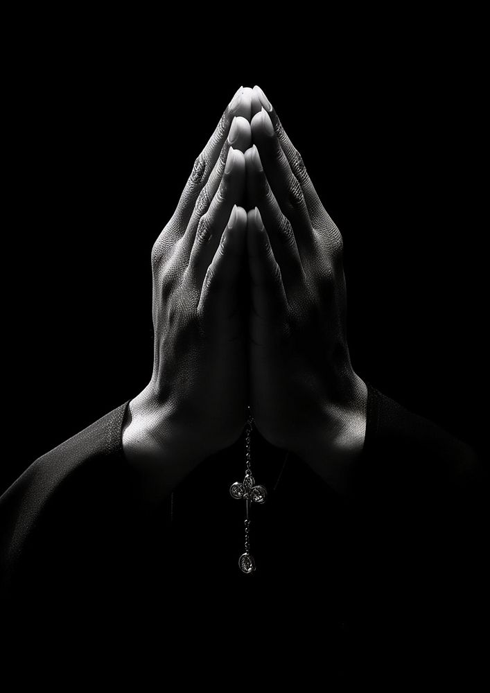 A praying hand 5cdu photography black. AI generated Image by rawpixel.