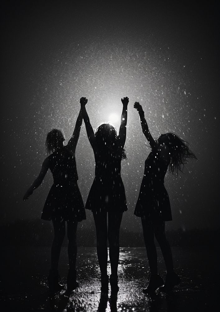 Three teenage dancing in the rain photography silhouette motion. 