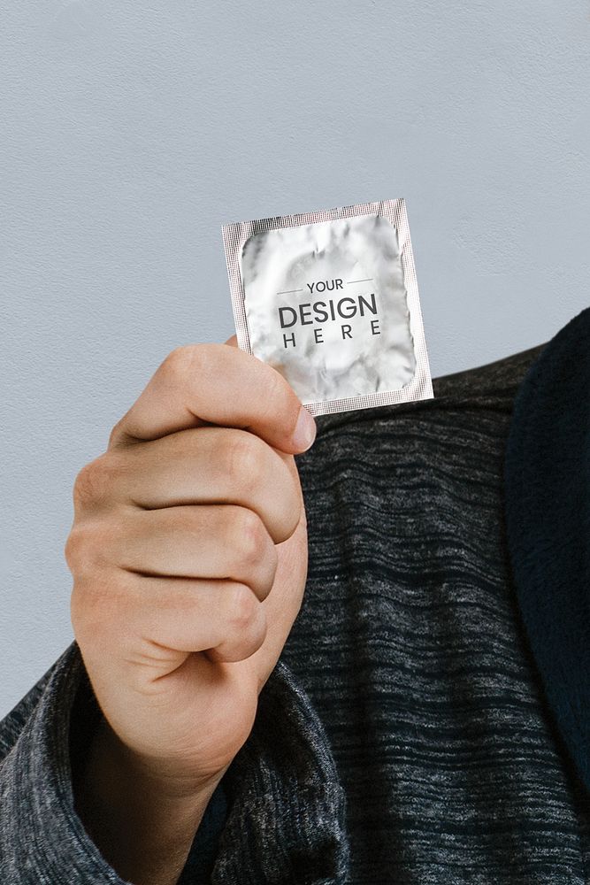 Man showing a latex condom