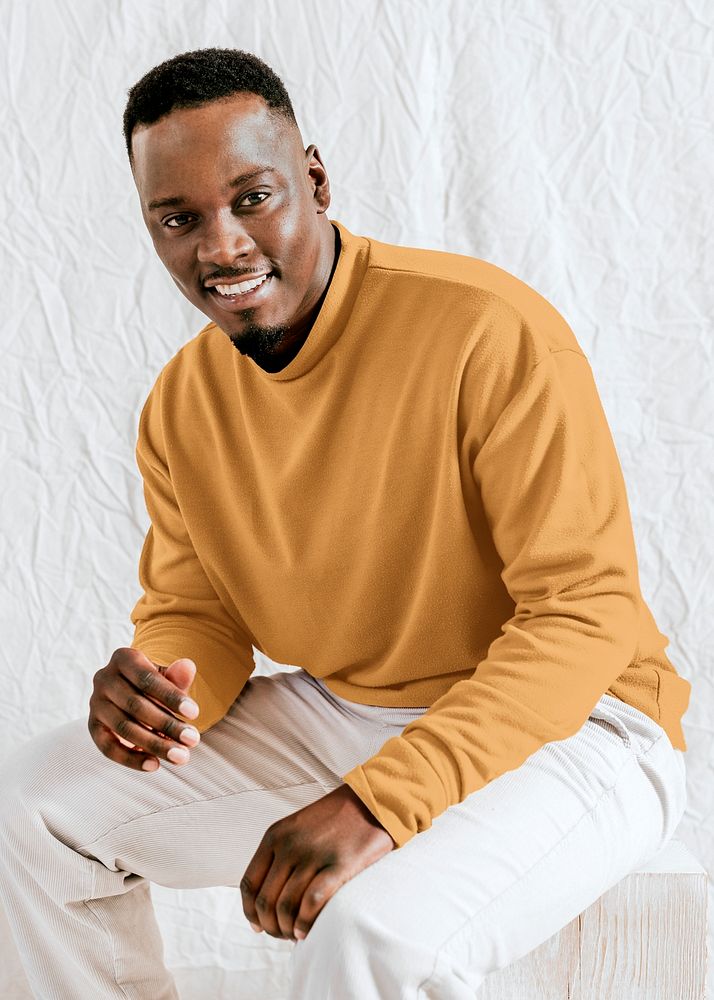 Happy black man in yellow long sleeve, autumn apparel fashion design