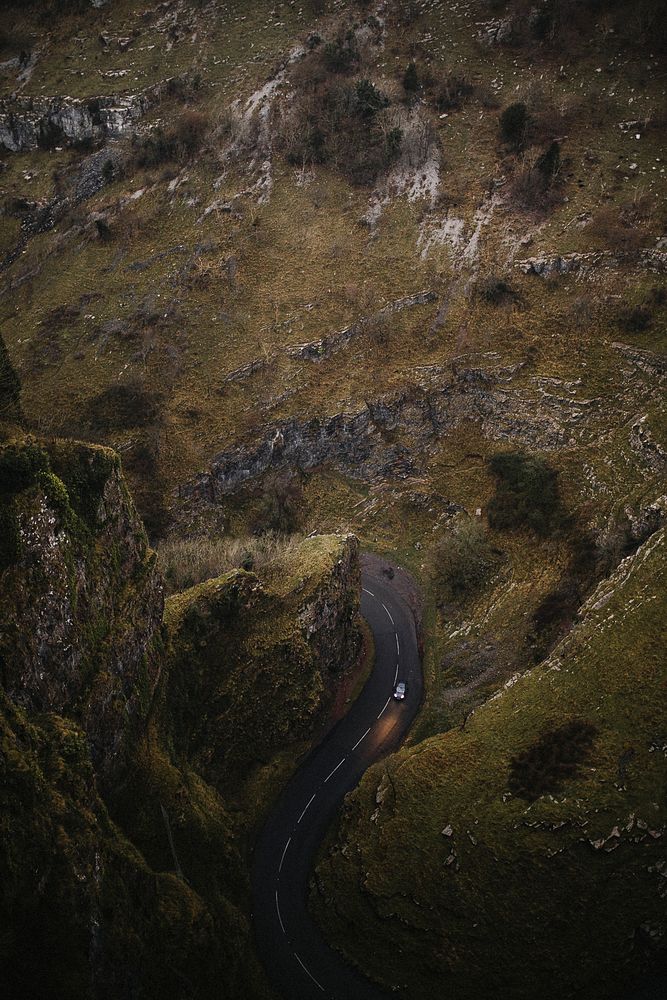 Aerial view of a curvy road and steep cliffs in Cheddar Gorge, England