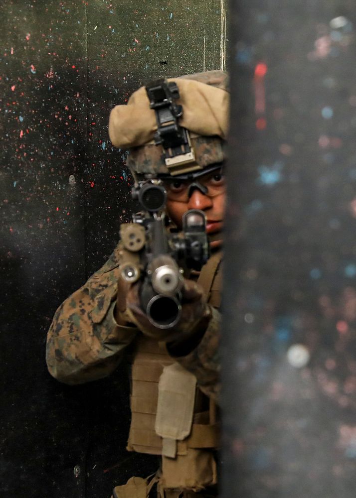 A U.S. Marine with the 22nd Marine Expeditionary Unit clears a rcorner before conducting live-fire close quarters battle…