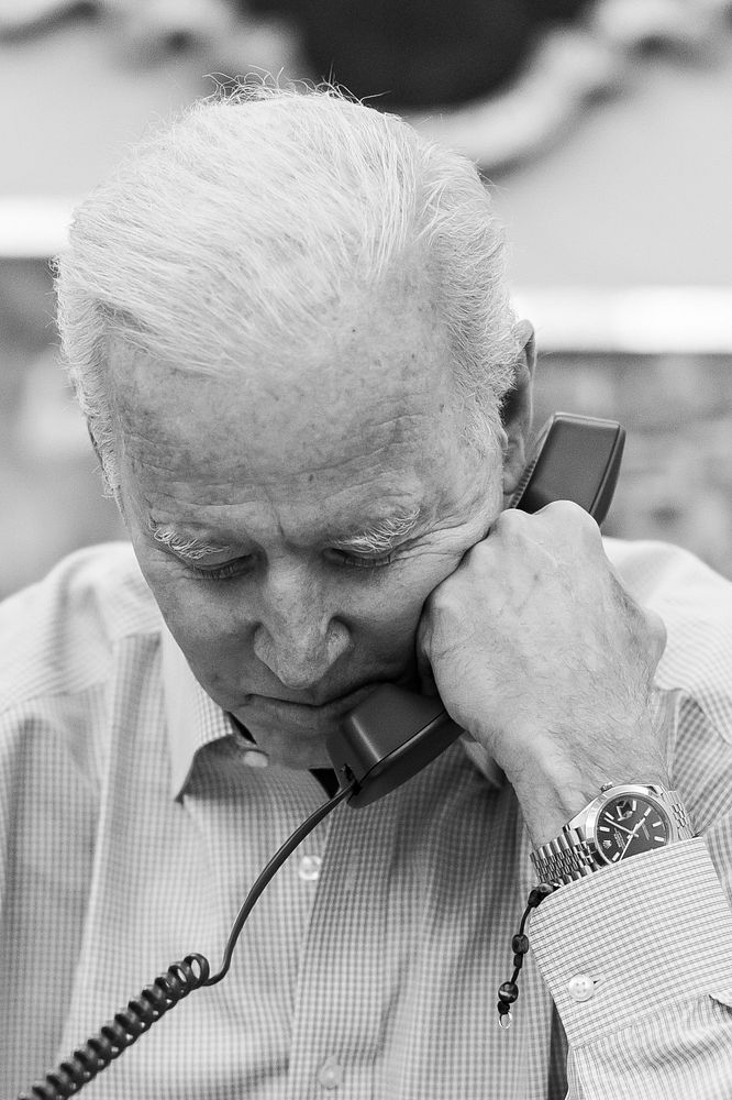 President Joe Biden makes a call Saturday, April 10, 2021, in the in his private dining area of the White House. (Official…