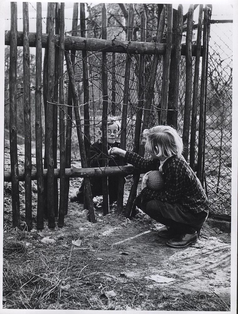 Children in East and West BerlinOctober 1961. Children keep their friendship across the barbed wire border between East and…