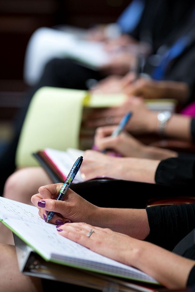 Attendees taking notes. Original public domain image from Flickr