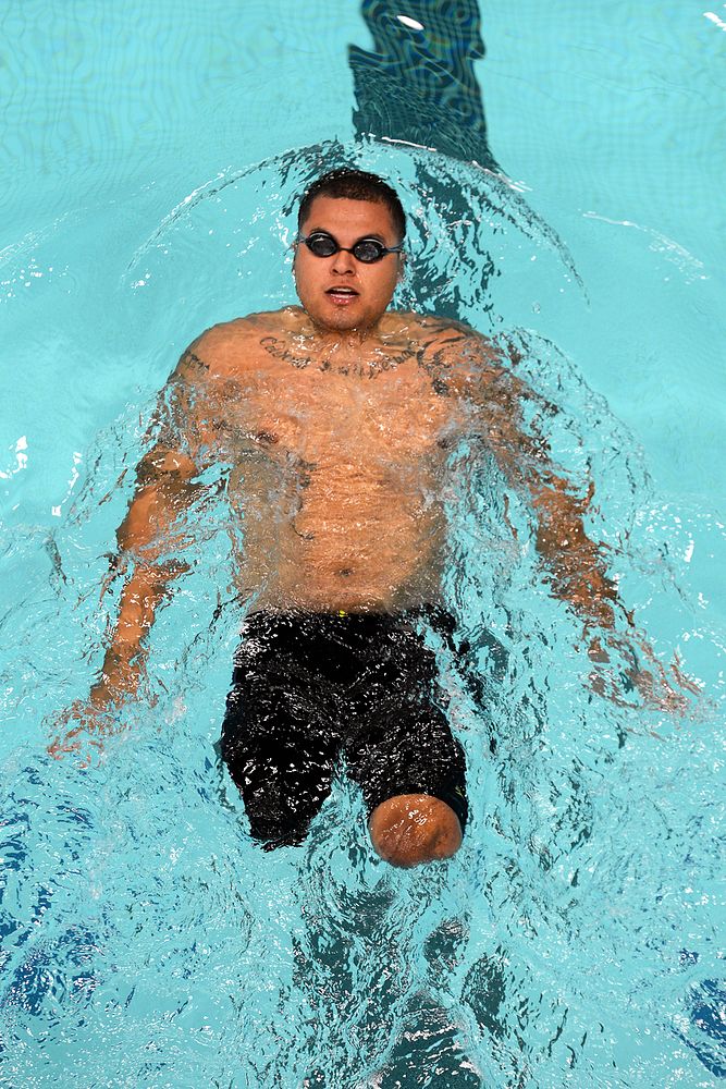 Marine Corps team's Jorge Salazar swims 50 meter backstroke in the prelimary round of the 2014 Warrior Games at the Olympic…