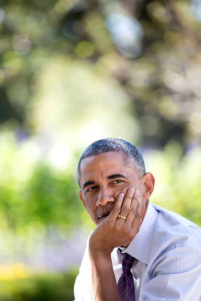 President Barack Obama listens during a technology strategy discussion in the Rose Garden of the White House, Oct. 8, 2014.