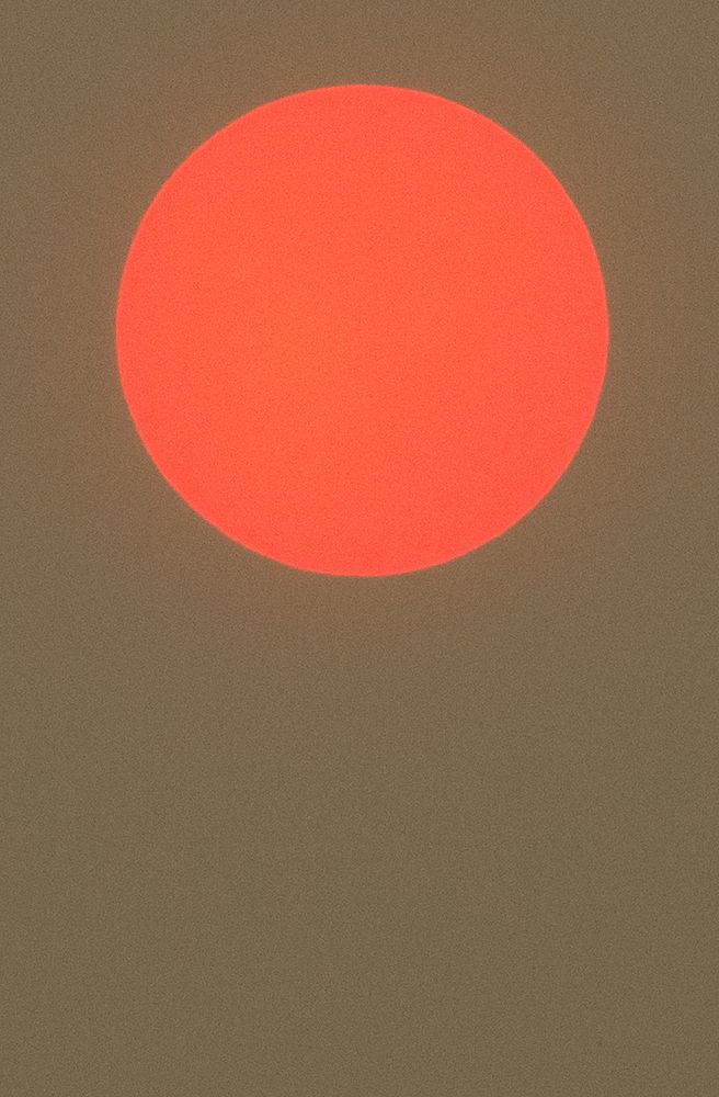 Super zoom large red sun setting. Original public domain image from Flickr