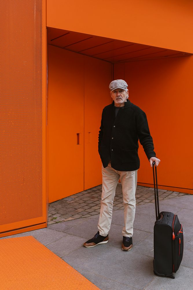 Senior man traveling with luggage 