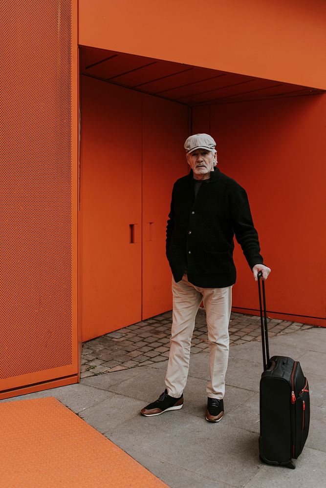 Senior man traveling with luggage 