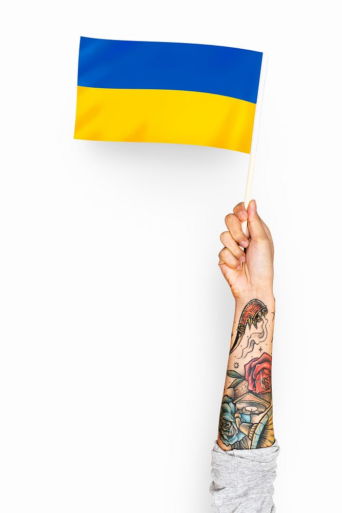 Tattooed hand holding Ukraine's flag photo, national identity