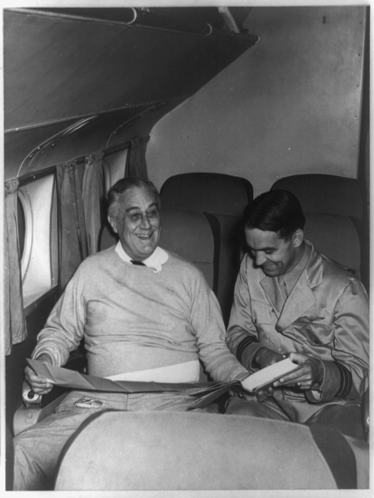 The first President ever to fly seems to enjoy it hugely. Here Mr. Roosevelt is shown [...]  on lap, in a relaxed and happy…