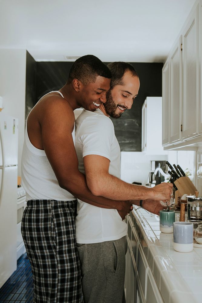 Gay couple hugging in the kitchen