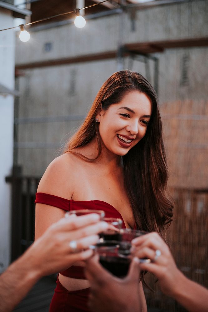 Beautiful girl toasting with her friends