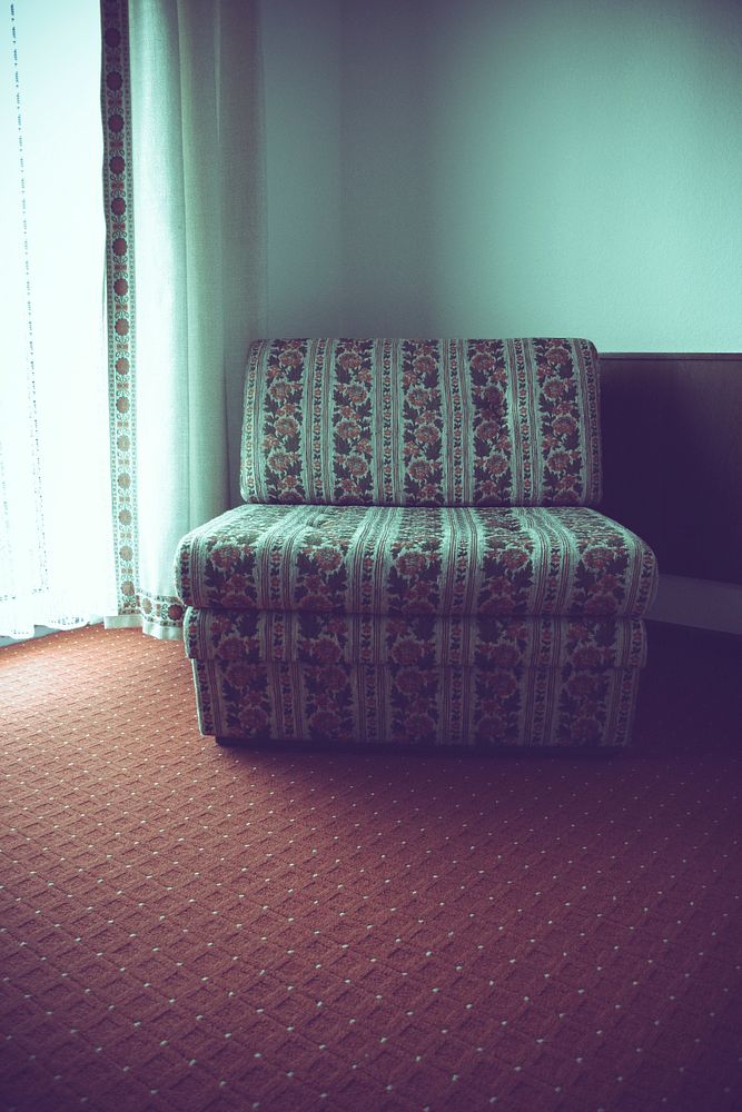 Floral upholstered chair in a room
