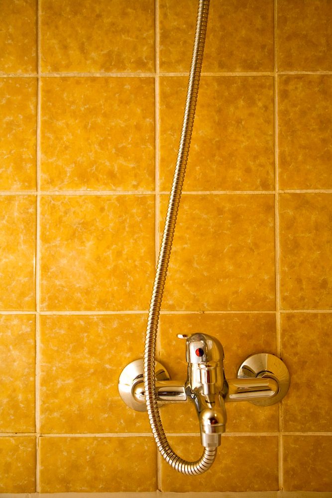 Shower with yellow tiles