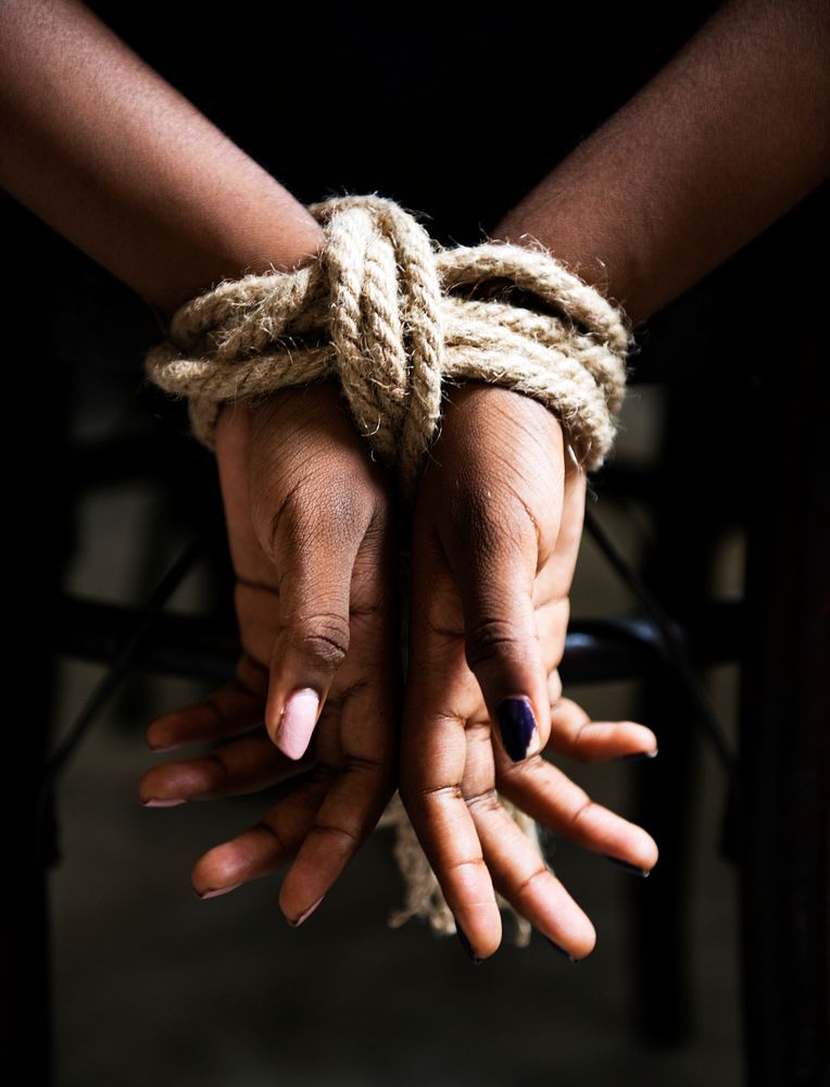 Woman hands tied up with a rope