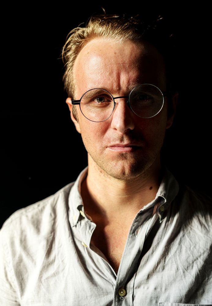 Closeup portrait of a guy wearing glasses