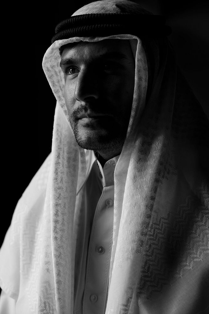 Arab man with thoughtful face expression grayscale