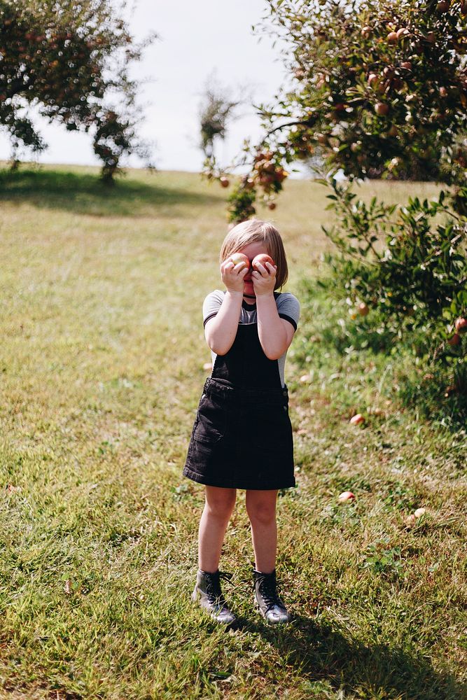 Little girl playing in a farm