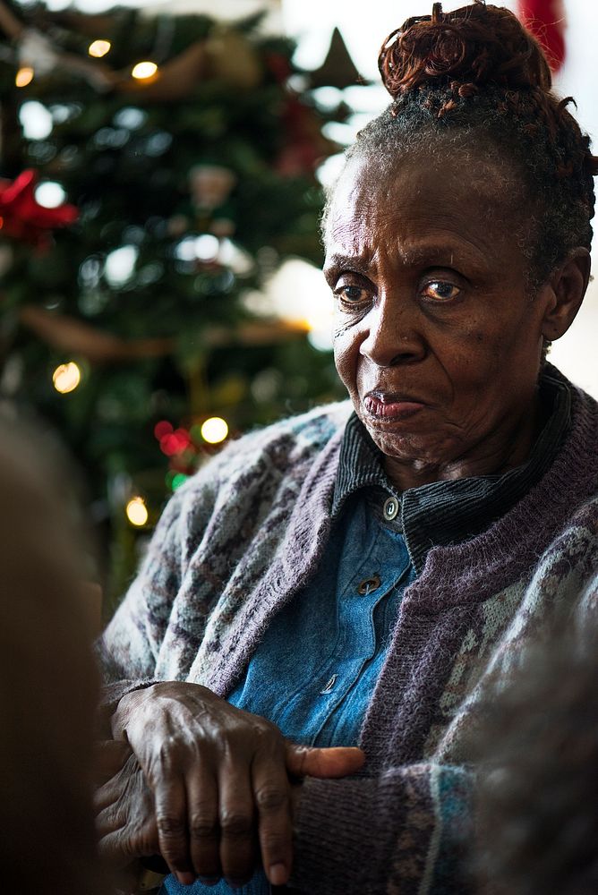 A black elderly woman in Christmas holiday