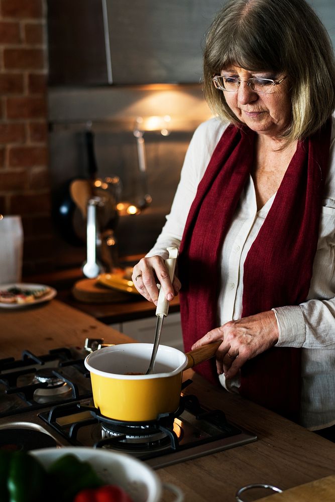A Caucasian woman cooking for Christmas dinner