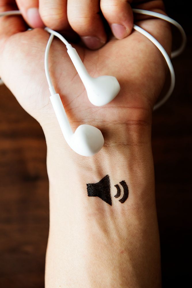 Speaker icon tattoo on a wrist
