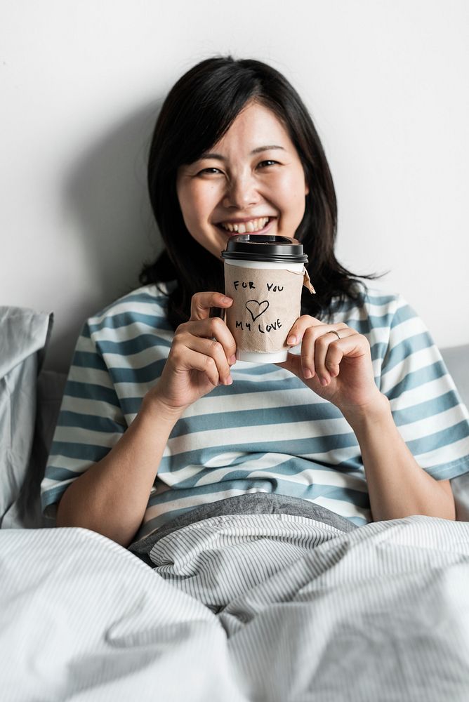 Asian woman with coffee cup