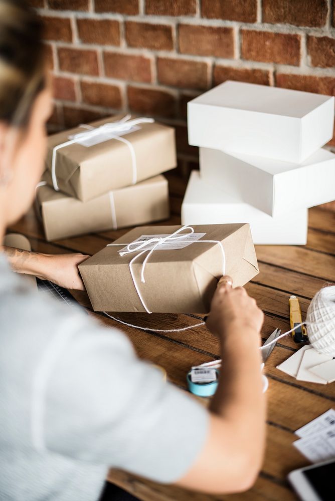 Woman packing parcels