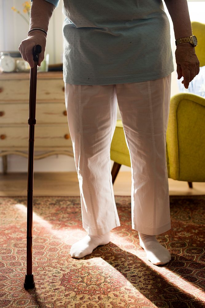 Senior woman using a cane