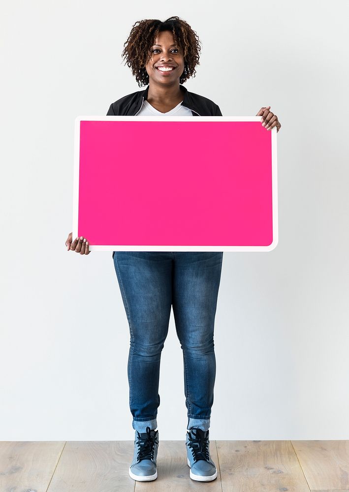 Black woman holding blank board