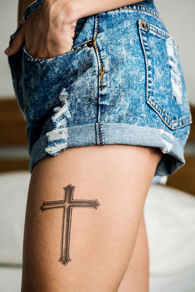 Closeup of a upper thigh tattoo of a woman
