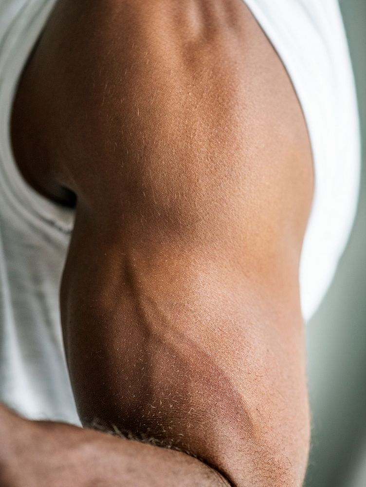 Closeup of a black person's muscular arm