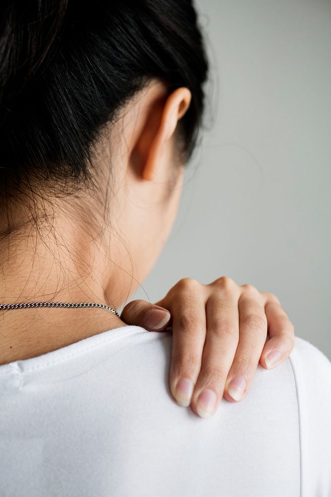 Asian woman suffering back pain