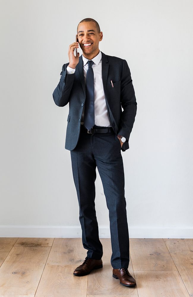 Businessman standing and talking on call