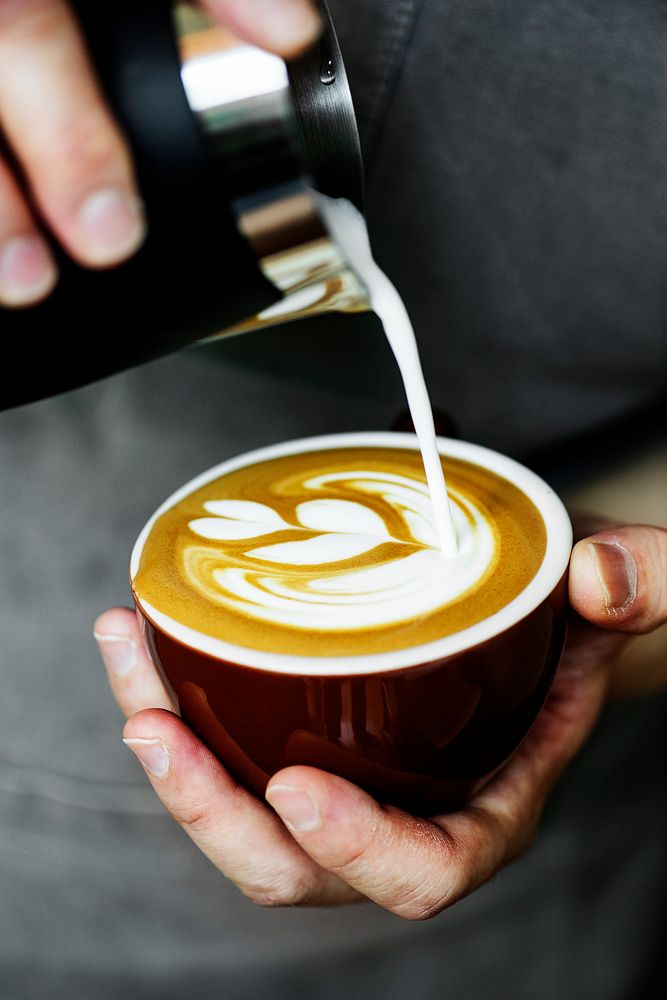 Closeup of barista making latte art