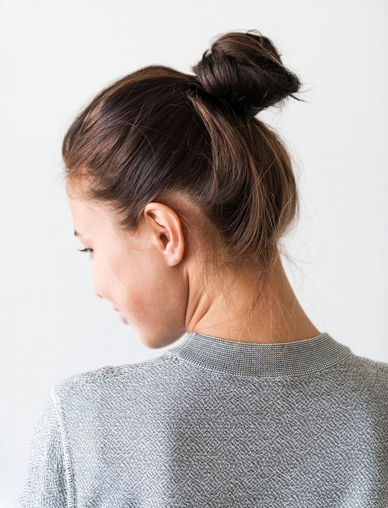 Woman making hair bun