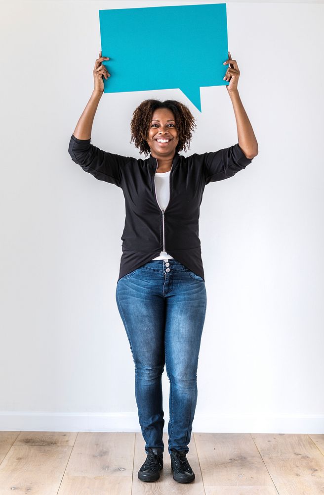 Black woman holding speech bubble icon