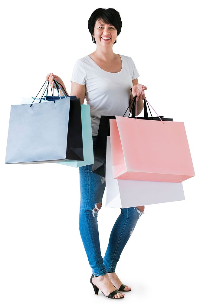 Woman showing shopping bags isolated