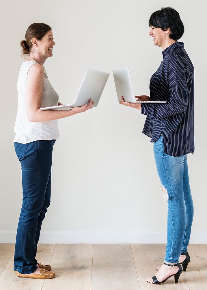 Women using laptop isolated