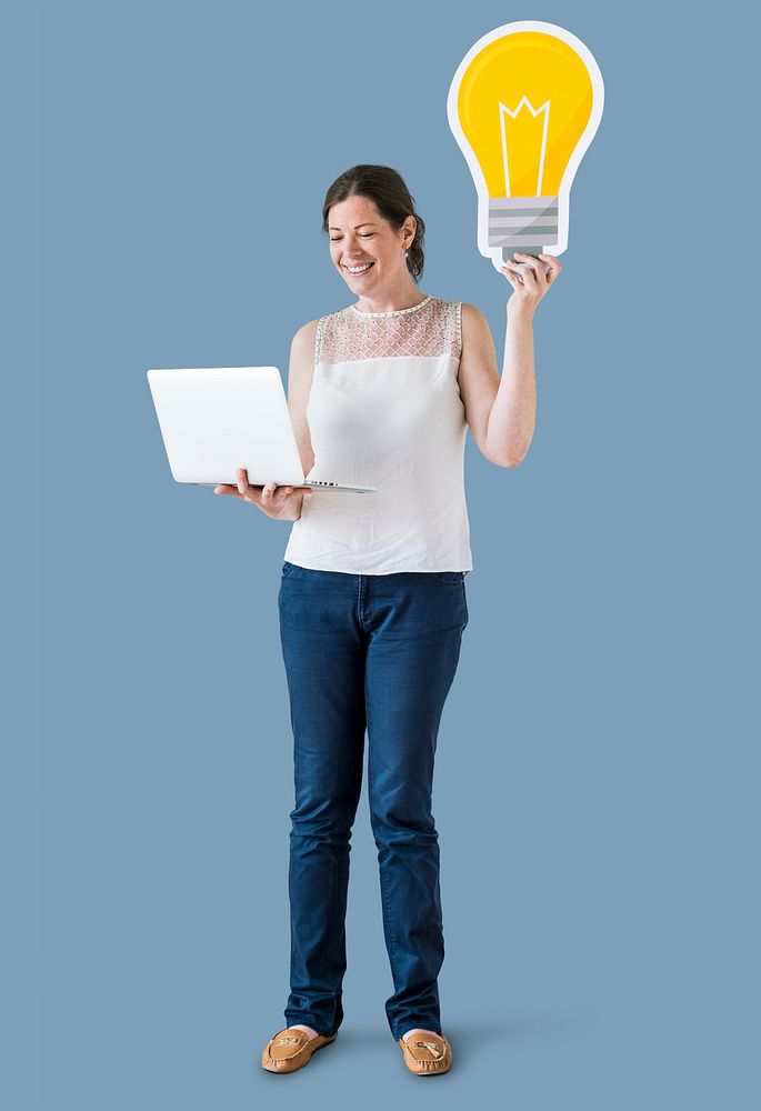 A woman holding light bulb icons