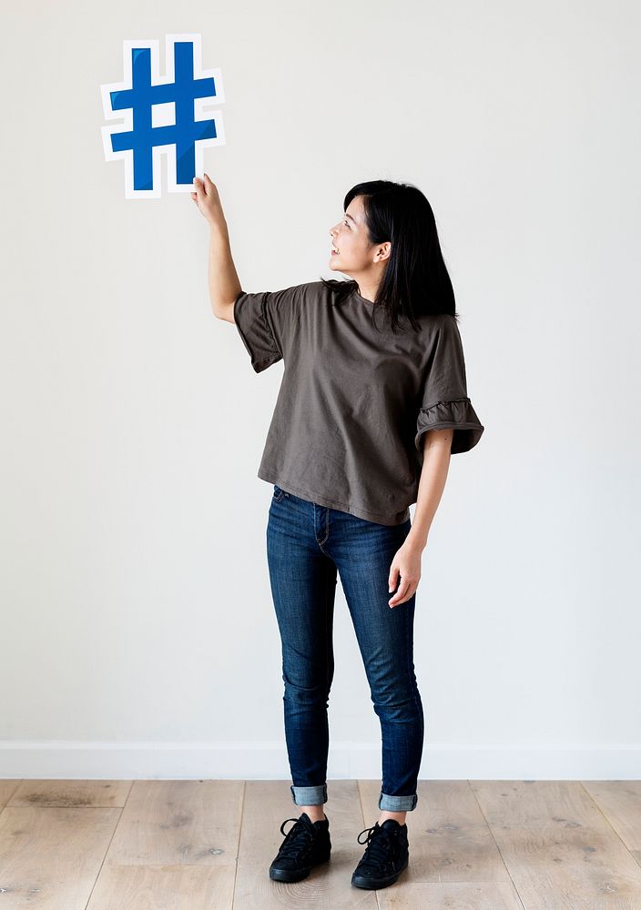 Woman holding a social network icon
