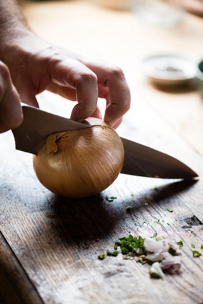 Onion being cut for cooking