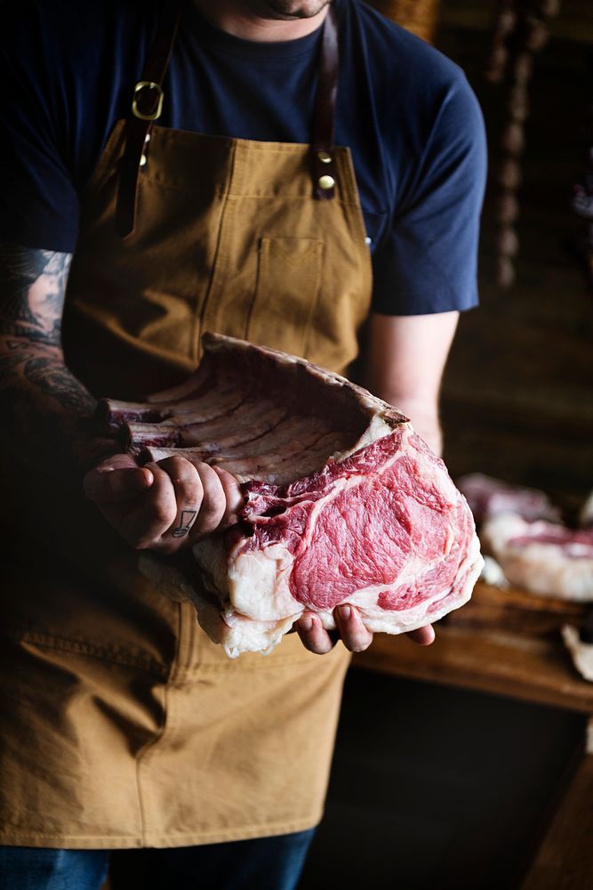 Butcher selling meat in a butcher shop food photography recipe idea