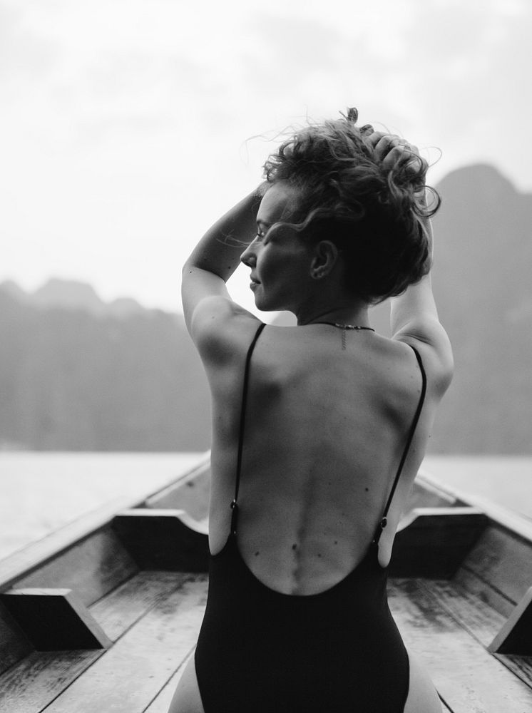 Beautiful woman posing on a boat