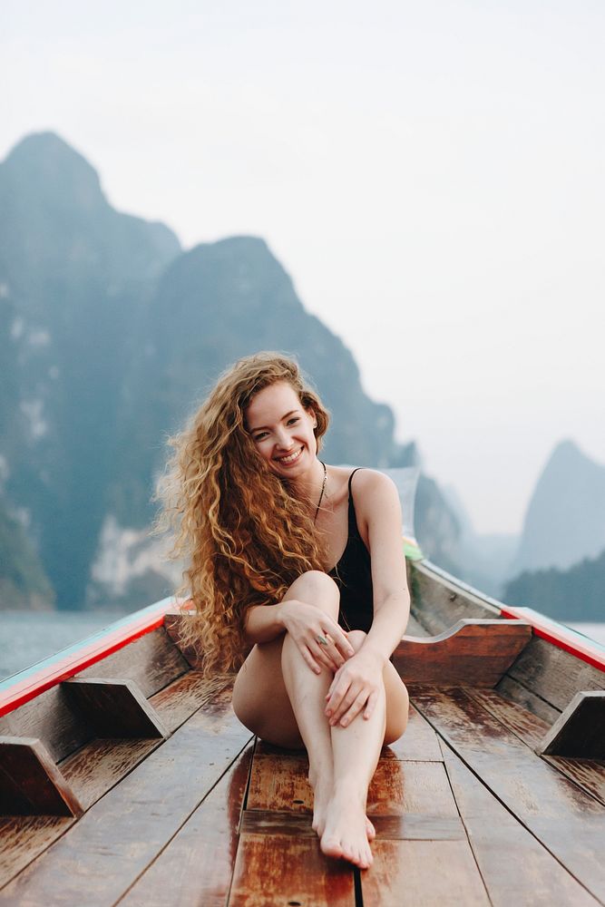 Beautiful woman posing on a boat