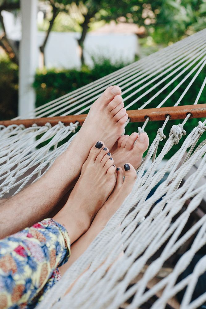 Couple resting together in a hammock