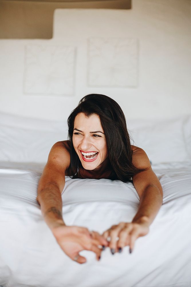 Beautiful woman relaxing in bed