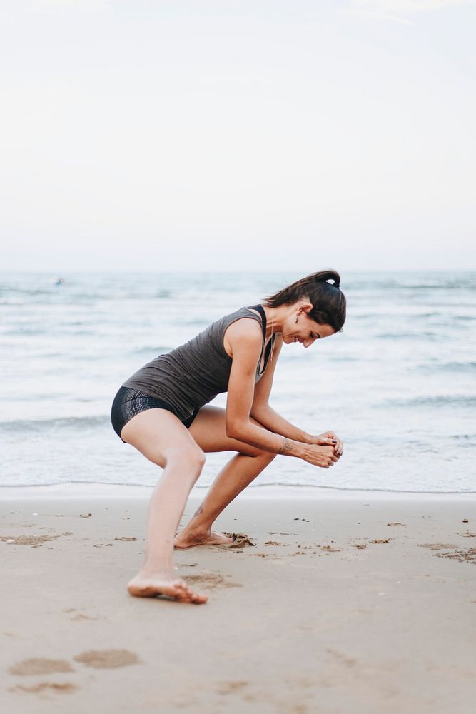 Woman exercising at the beach