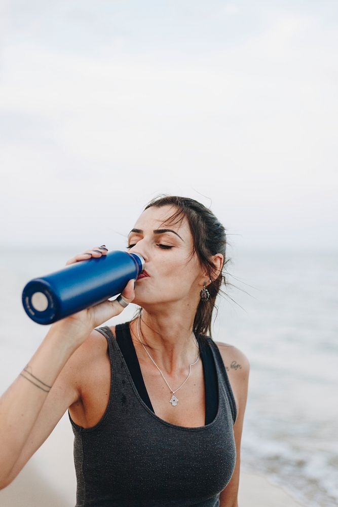 Woman drinking water after a workout